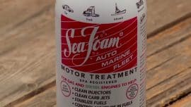On the table there is a spray can labeled Sea Foam